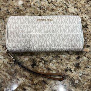 White and tan MK wallet